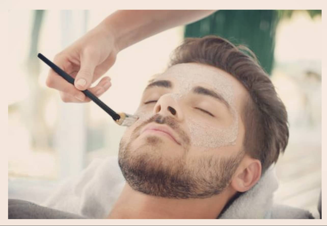 Man having facial at The Glow Beautique